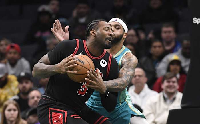 Charlotte Hornets forward Miles Bridges (0) goes after the ball in possession of Chicago Bulls center Andre Drummond (3) during the first half at the Spectrum Center. 